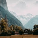Brown Wooden House Near Tall Trees and Mountains  screen for extension Chrome web store in OffiDocs Chromium