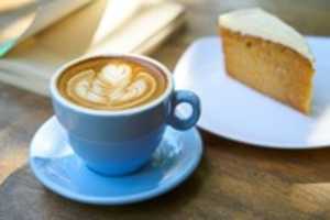 Free download Cappuccino Coffee Beside The Sliced Cake On Plate free photo or picture to be edited with GIMP online image editor