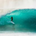 captures a surfer riding a massive wave  screen for extension Chrome web store in OffiDocs Chromium