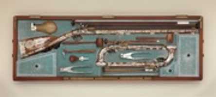 Free download Cased set of a flintlock rifle, a pair of pistols, and accessories free photo or picture to be edited with GIMP online image editor
