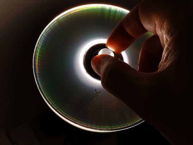 Free download cd dvd data data store hand grasp free picture to be edited with GIMP free online image editor