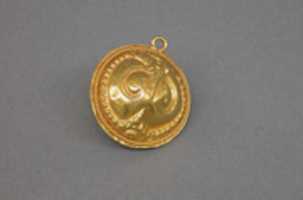 Free download Circular Pendant with Abstract Foliate Motifs free photo or picture to be edited with GIMP online image editor