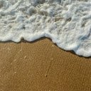 Close up of a Foamy Wave on the Shore  screen for extension Chrome web store in OffiDocs Chromium