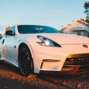 Contemporary coupe cars parked on road in village  screen for extension Chrome web store in OffiDocs Chromium