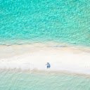 Couple Lying Down on a Beach  screen for extension Chrome web store in OffiDocs Chromium