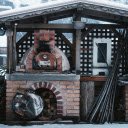 Cozy Outdoor Pizza Oven in Snowy Setting  screen for extension Chrome web store in OffiDocs Chromium