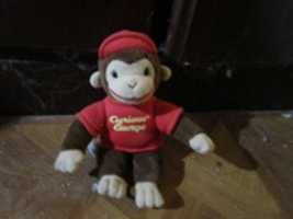 Free download Curious George Plush Toy with a Hat and a Shirt free photo or picture to be edited with GIMP online image editor
