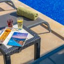 Drinks and a Snack on the Table by the Swimming Pool  screen for extension Chrome web store in OffiDocs Chromium