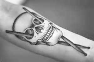 Free download Drumsticks through a human skull free photo or picture to be edited with GIMP online image editor