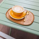 Elegance in Every Sip: Cappuccino on a Green Table  screen for extension Chrome web store in OffiDocs Chromium
