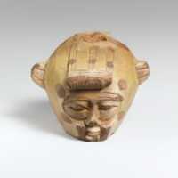 Free download Faience aryballos (oil flask) in the form of a head wearing an animal skin free photo or picture to be edited with GIMP online image editor