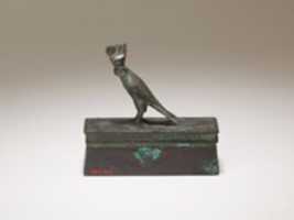 Free download Falcon in double crown surmounting a shrine form box for an animal mummy free photo or picture to be edited with GIMP online image editor