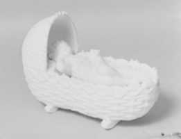 Free download Figure of a Baby in a Cradle Holding a Kitten free photo or picture to be edited with GIMP online image editor