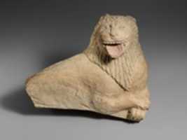 Free download Fragment of a limestone funerary stele with a recumbent lion free photo or picture to be edited with GIMP online image editor