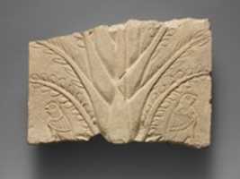 Free download Fragment of a limestone relief with a tree and birds of prey free photo or picture to be edited with GIMP online image editor