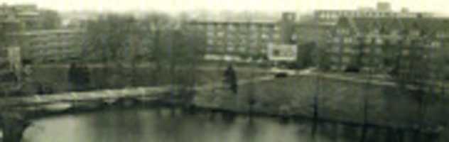 Free download Full Building And Additions With Bridge And Lake free photo or picture to be edited with GIMP online image editor