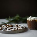 Gingerbread Star Beside a Cup of Hot Choco  screen for extension Chrome web store in OffiDocs Chromium