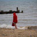 Girl in red shirt on the beach  screen for extension Chrome web store in OffiDocs Chromium