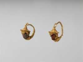 Free download Gold and amber earrings with head of a black youth free photo or picture to be edited with GIMP online image editor