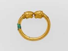 Free download Gold and copper alloy bracelet with lion-head finials free photo or picture to be edited with GIMP online image editor