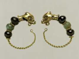 Free download Gold, beryl, and garnet earring with head of a dolphin free photo or picture to be edited with GIMP online image editor