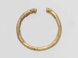 Free download Gold bracelet with finials in the form of feline heads free photo or picture to be edited with GIMP online image editor
