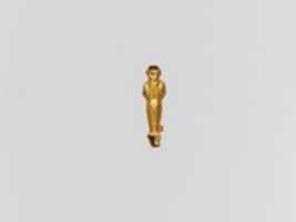 Free download Gold pendant capsule in the form of a male figure free photo or picture to be edited with GIMP online image editor