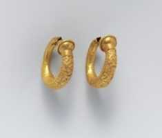 Free download Gold trumpet-shaped earrings with relief decoration free photo or picture to be edited with GIMP online image editor