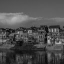 Grayscale Photo of Buildings by a Riverside  screen for extension Chrome web store in OffiDocs Chromium