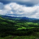 Green Valley Under a Cloudy Sky  screen for extension Chrome web store in OffiDocs Chromium