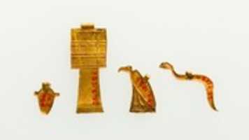 Free download Group of 4 Amulets of Djedmutesankh: Cobra, Vulture, Heart, and Djed Pillar free photo or picture to be edited with GIMP online image editor