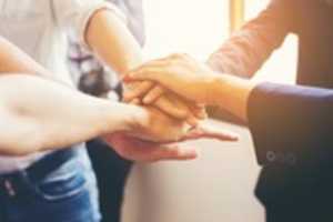 Free download hands-joined-by-the-team_1150-100 free photo or picture to be edited with GIMP online image editor