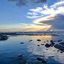landscape sea covered rocks sunlight cloudy sky sunset  screen for extension Chrome web store in OffiDocs Chromium
