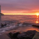 Lighthouse with sun on the sea  screen for extension Chrome web store in OffiDocs Chromium