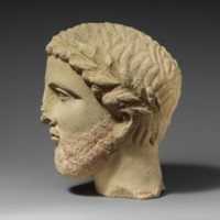 Free download Limestone bearded head with a wreath of leaves free photo or picture to be edited with GIMP online image editor