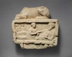 Free download Limestone finial of a funerary stele with a recumbent lion and a banquet scene free photo or picture to be edited with GIMP online image editor