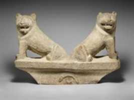 ดาวน์โหลดฟรี Limestone finial of a funerary stele with two seated lions free photo or picture to be edited with GIMP online image editor