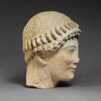 Free download Limestone head of a beardless male with a wreath of flower buds free photo or picture to be edited with GIMP online image editor