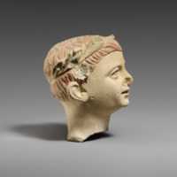 Free download Limestone head of a boy with a wreath of leaves free photo or picture to be edited with GIMP online image editor