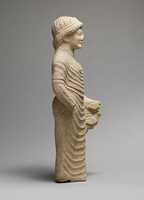 Free download Limestone statue of a male votary holding a bird in the left hand free photo or picture to be edited with GIMP online image editor