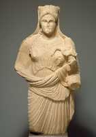 Free download Limestone statue of Aphrodite holding winged Eros free photo or picture to be edited with GIMP online image editor