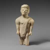 Free download Limestone statuette of a bearded male votary in Greek dress free photo or picture to be edited with GIMP online image editor