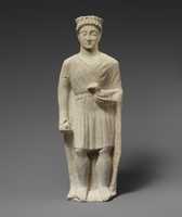 Free download Limestone statuette of a beardless male votary holding a bird free photo or picture to be edited with GIMP online image editor