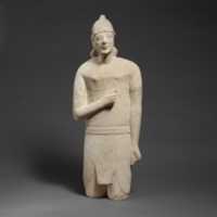 Free download Limestone statuette of a beardless male votary in Egyptianizing dress wearing a helmet free photo or picture to be edited with GIMP online image editor