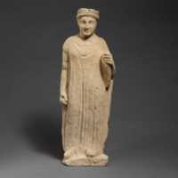 Free download Limestone statuette of a boy holding a bird free photo or picture to be edited with GIMP online image editor