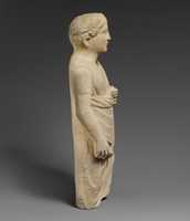 Free download Limestone statuette of a boy holding a pyxis and a branch of leaves free photo or picture to be edited with GIMP online image editor