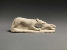 Free download Limestone statuette of a coursing hound seizing a hare free photo or picture to be edited with GIMP online image editor