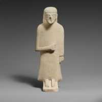 Free download Limestone statuette of a male votary with a long garment and a plain headdress free photo or picture to be edited with GIMP online image editor