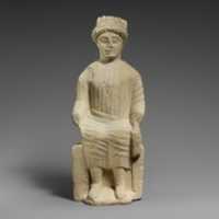 Free download Limestone statuette of a seated beardless male votary free photo or picture to be edited with GIMP online image editor