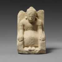 Free download Limestone statuette of a seated beardless male votary with a helmet free photo or picture to be edited with GIMP online image editor